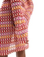 crochet long sve mini dress in red and orange stripe