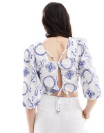 cropped embroidered woven top with tie back in white